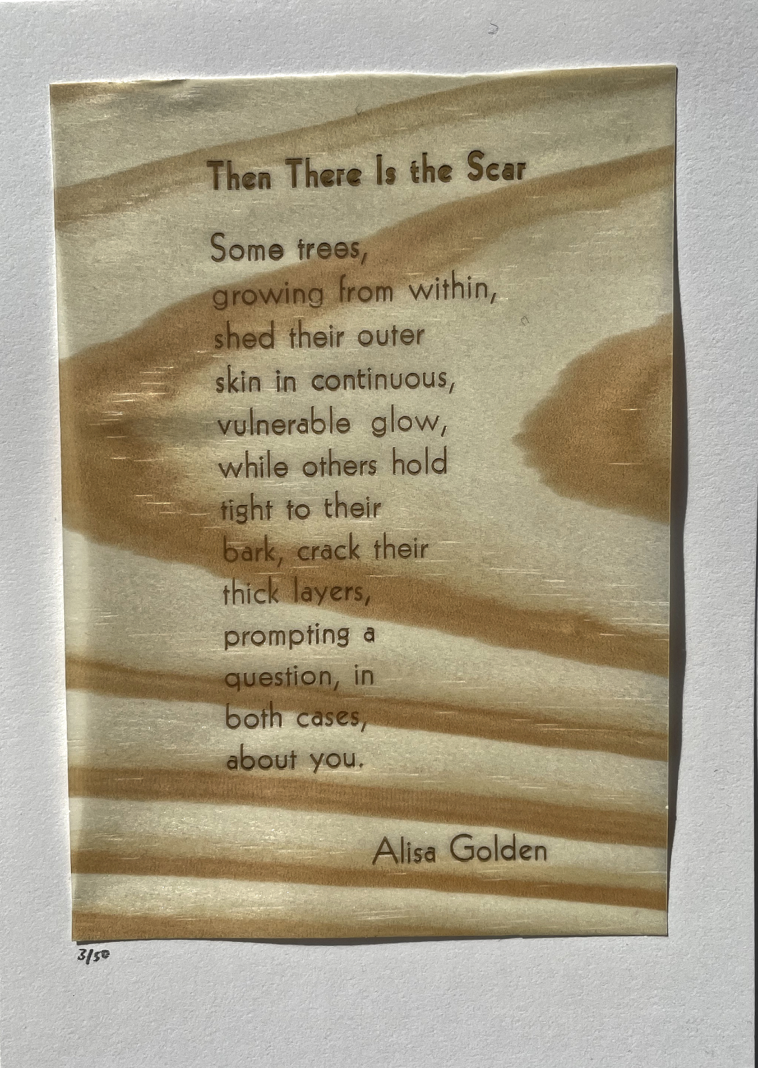 poem printed on thin shave of wood