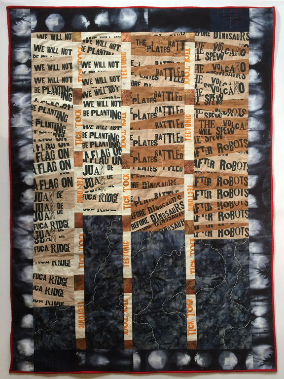 quilt with fragments of text and stitching like topographic map