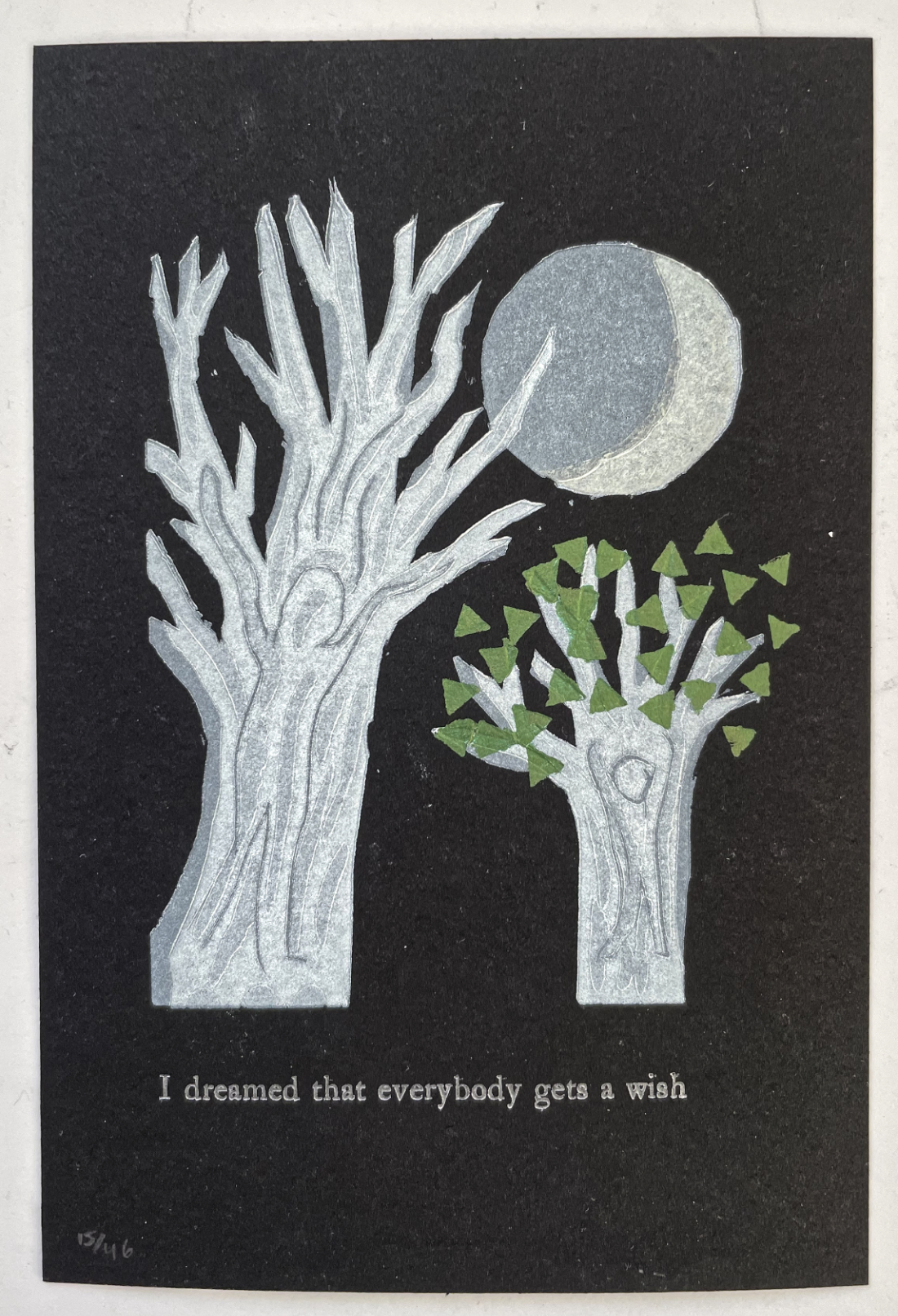 linocut of two trees on black background with moon