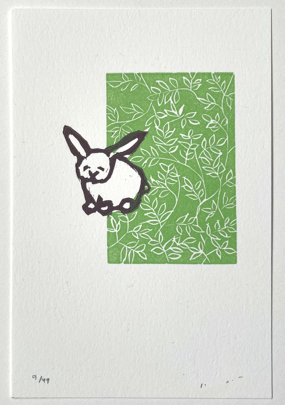 linocut of bunny on floral background