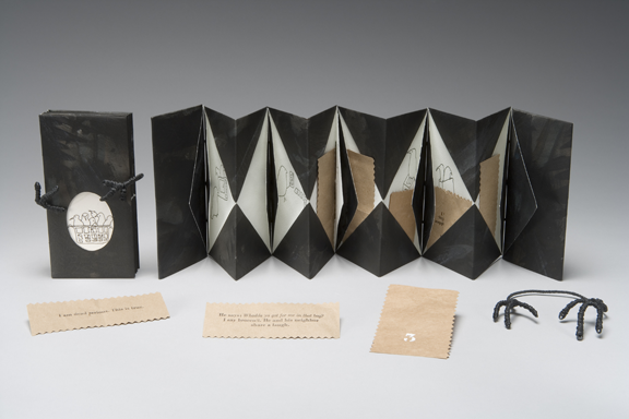 accordion folded book with drawings of crows and wire crow's foot closure