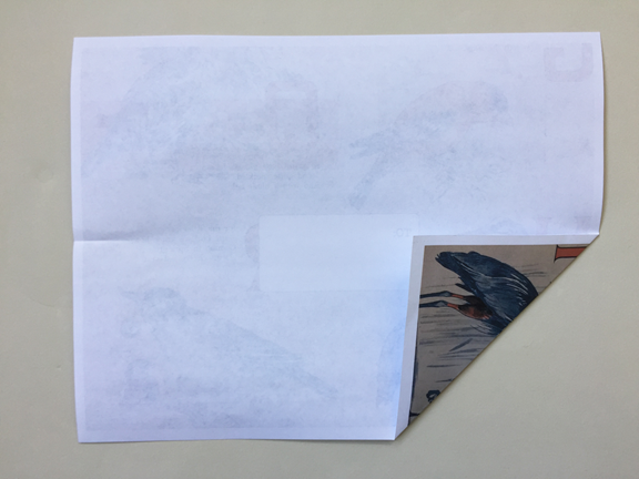 bottom right corner folded up to align with the right crease