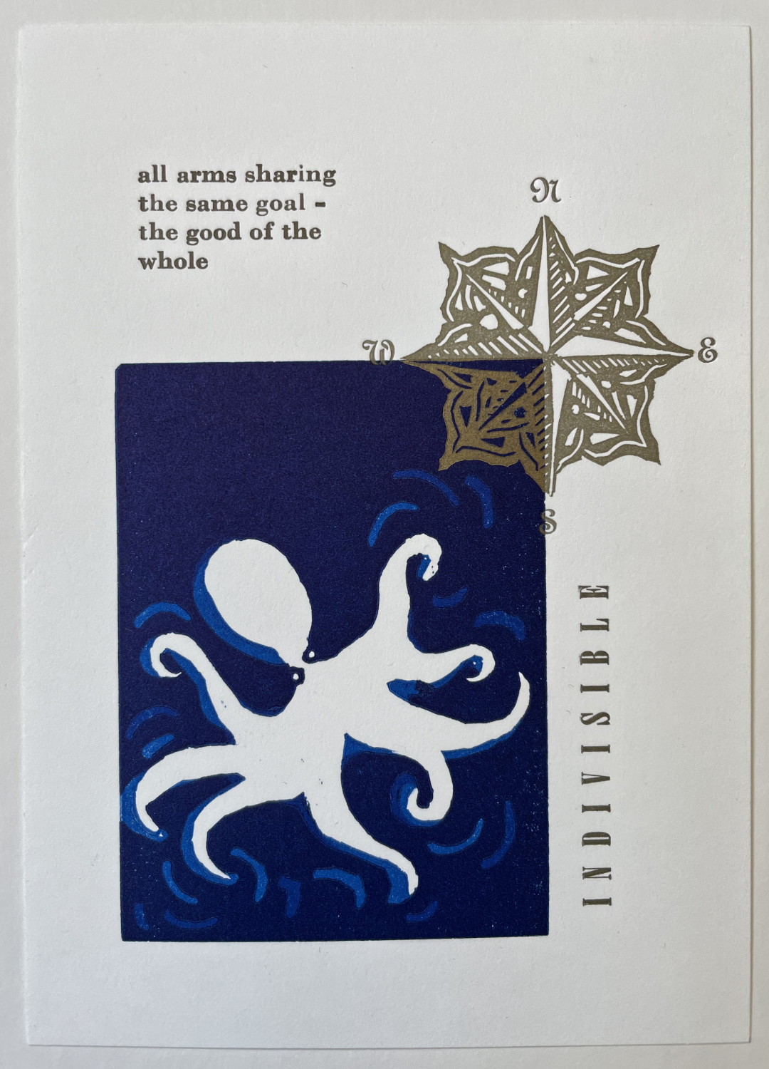 linocut of octopus and compass rose with text that says indivisible all arms sharing the same goal the good of the whole