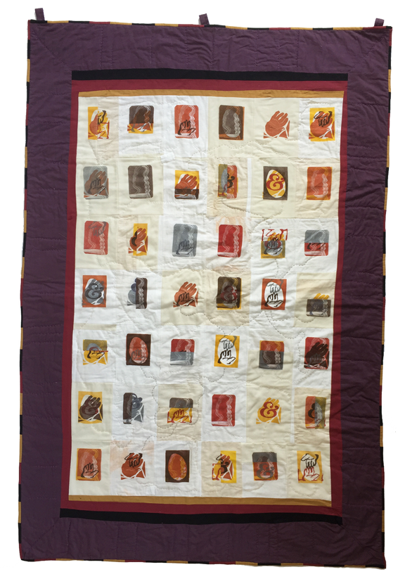 block quilt with various prints of hands and people