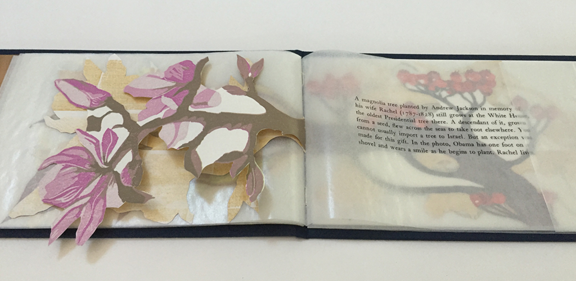 open book with print of magnolia branch