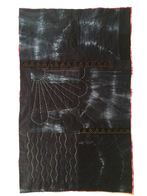 pieced quilt with raven black tie-dye and sunburst stitching